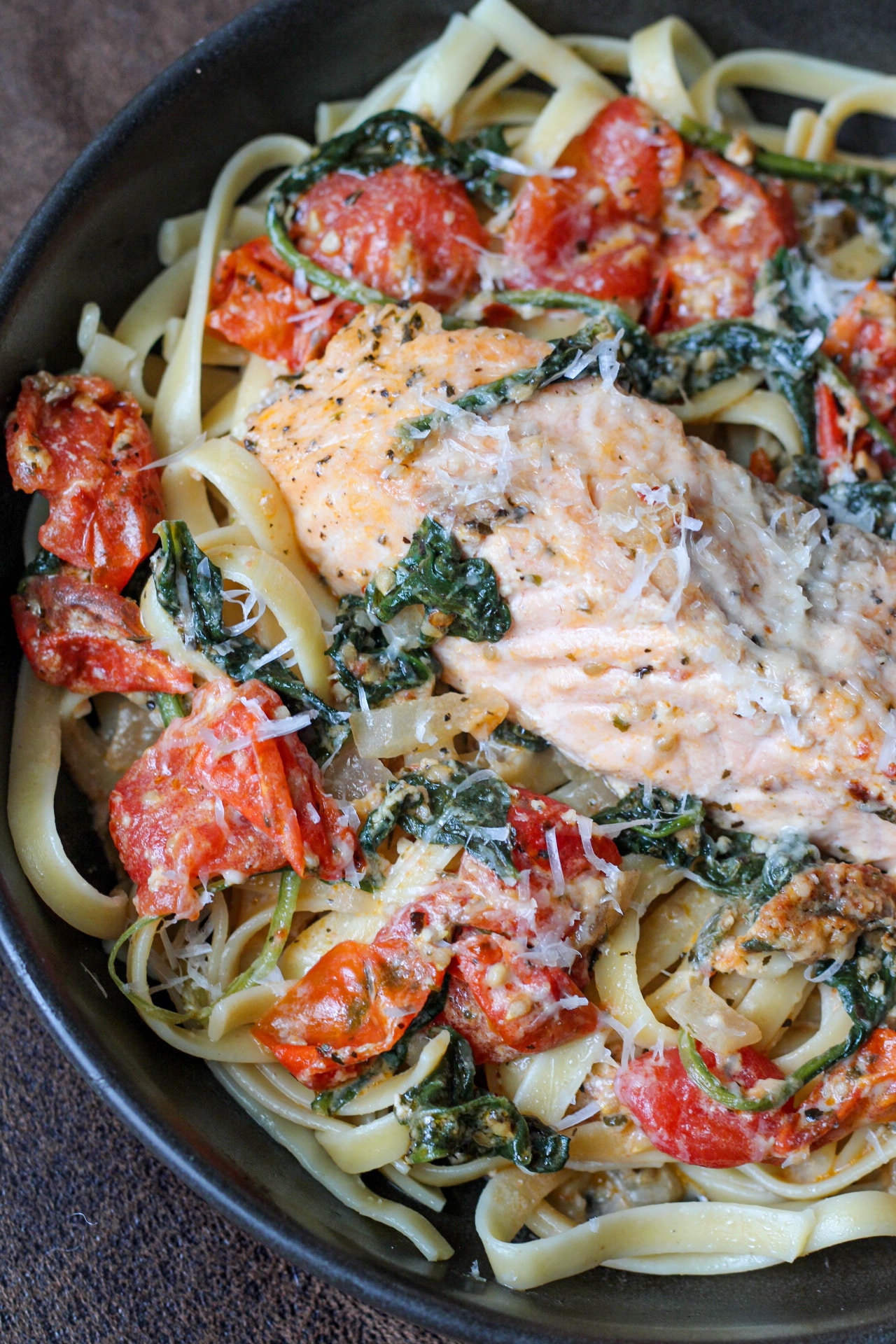 creamy tuscan salmon pasta with tomatoes and spinach